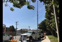 A photo of a drill rig on the side of a closed street