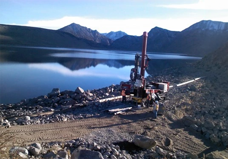 A geotech drill rig in the mountains
