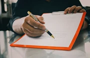 a photo of a contract waiting for signature