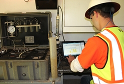 Pictured: Cascade Environmental employee monitoring injection remediation project