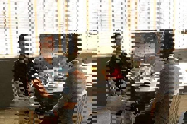 two workers sitting