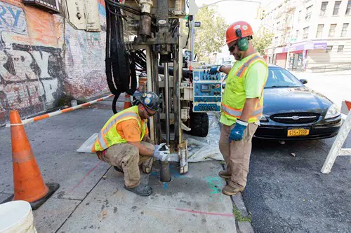 Drilling into the ground for soil and ground water samples.